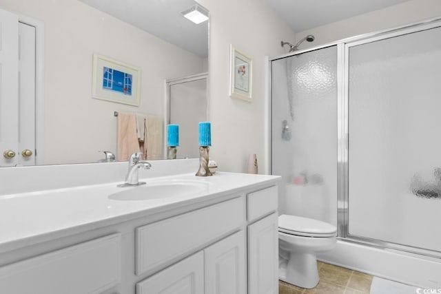 bathroom featuring vanity, toilet, and walk in shower