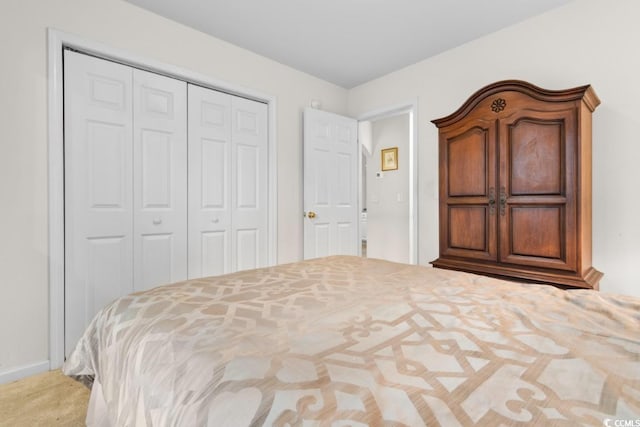 unfurnished bedroom with a closet and carpet flooring