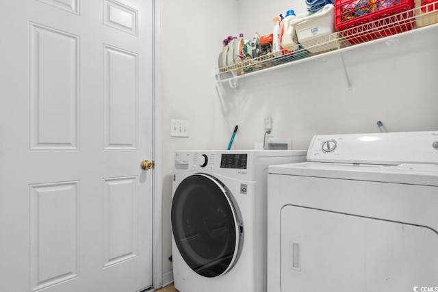 laundry room featuring washing machine and dryer