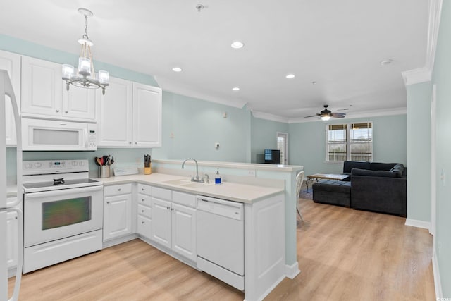395 S Crow Creek Dr Unit 1418, Calabash, NC 28467 - kitchen with white appliances, a sink, ornamental molding, a peninsula, and ceiling fan
