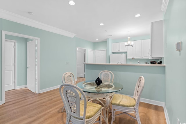 395 S Crow Creek Dr Unit 1418, Calabash, NC 28467 - dining space with baseboards, light wood-type flooring, recessed lighting, a chandelier, and crown molding