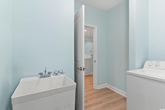 395 S Crow Creek Dr Unit 1418, Calabash, NC 28467 - washroom with washer / dryer, light wood-style floors, and baseboards