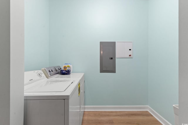 395 S Crow Creek Dr Unit 1418, Calabash, NC 28467 - washroom with electric panel, washing machine and dryer, light wood-style floors, and baseboards