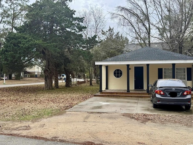 view of outbuilding featuring covered porch