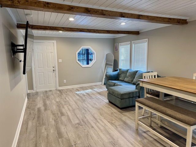 interior space featuring beamed ceiling, light wood-type flooring, wood ceiling, and baseboards