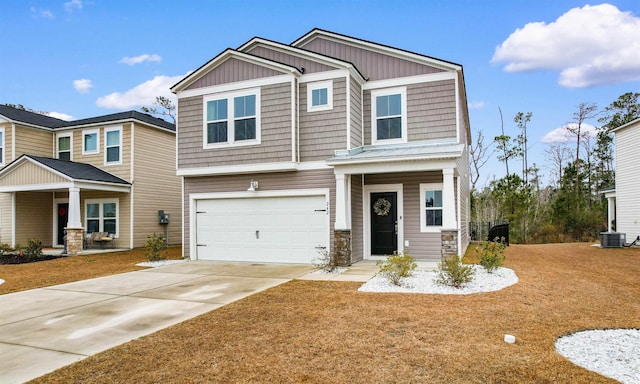 242 Timber Oaks Dr, Myrtle Beach, SC 29588 - craftsman-style house with central AC unit, a garage, driveway, and a front yard