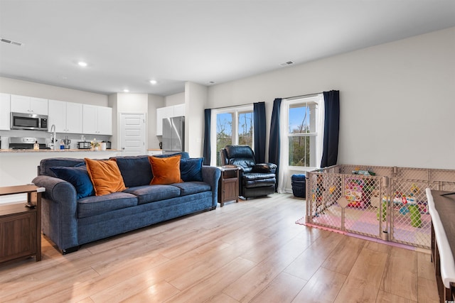 242 Timber Oaks Dr, Myrtle Beach, SC 29588 - living room featuring light wood-style flooring and recessed lighting