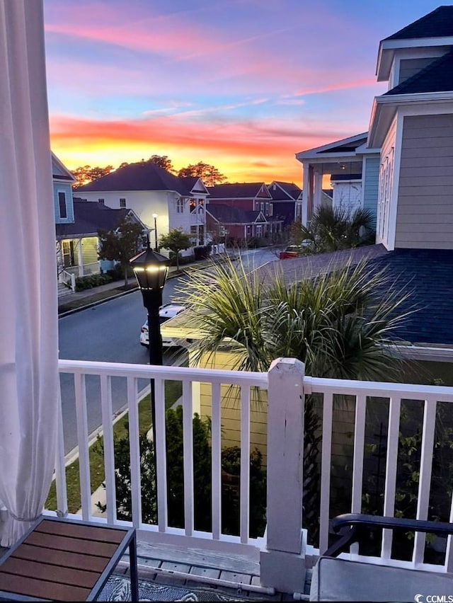 view of balcony at dusk