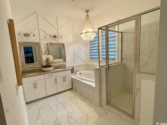 bathroom with vanity, a notable chandelier, and plus walk in shower