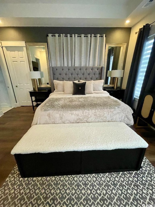 bedroom featuring dark hardwood / wood-style flooring