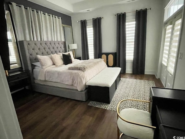 bedroom featuring dark wood-type flooring