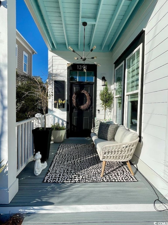 view of exterior entry with covered porch