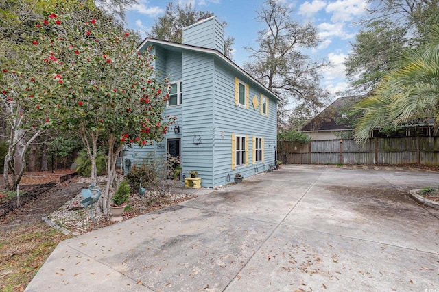 rear view of property featuring a patio