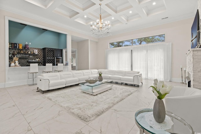 living room featuring coffered ceiling, crown molding, a notable chandelier, beamed ceiling, and a high ceiling