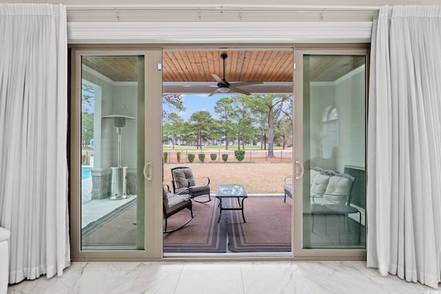 entryway with plenty of natural light and ceiling fan