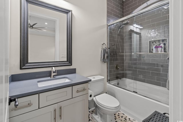 full bathroom with vanity, ceiling fan, shower / bath combination with glass door, and toilet