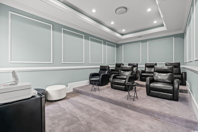 carpeted home theater room with crown molding