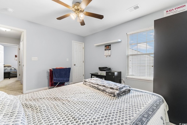 carpeted bedroom with ceiling fan