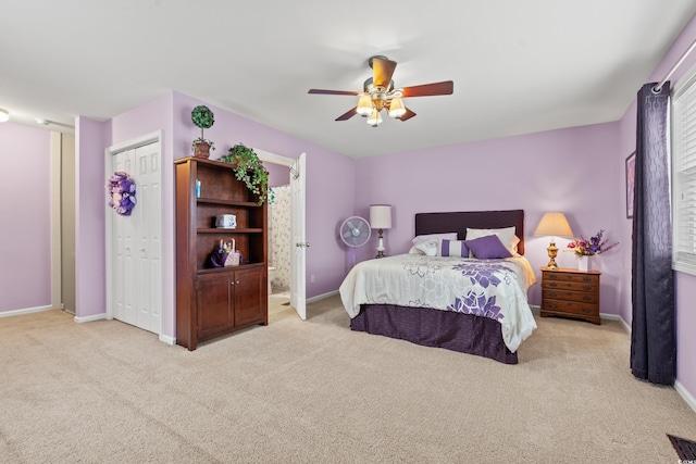 bedroom featuring ceiling fan and light colored carpet