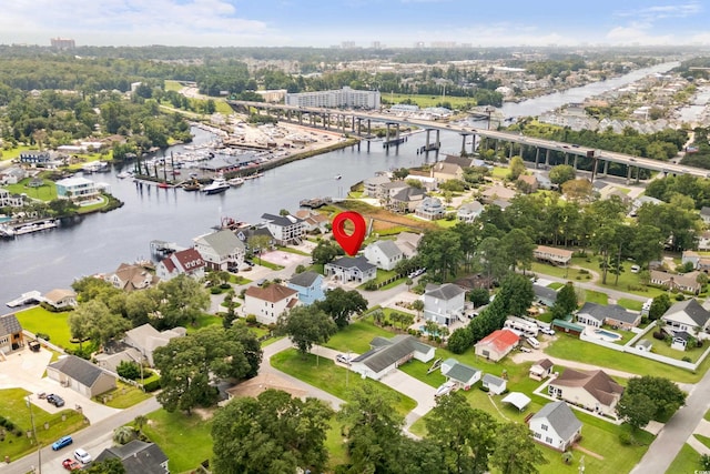 birds eye view of property featuring a water view and a residential view