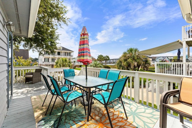 exterior space featuring a deck and outdoor dining area