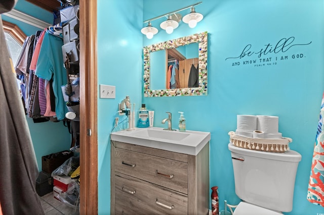 bathroom with toilet and vanity