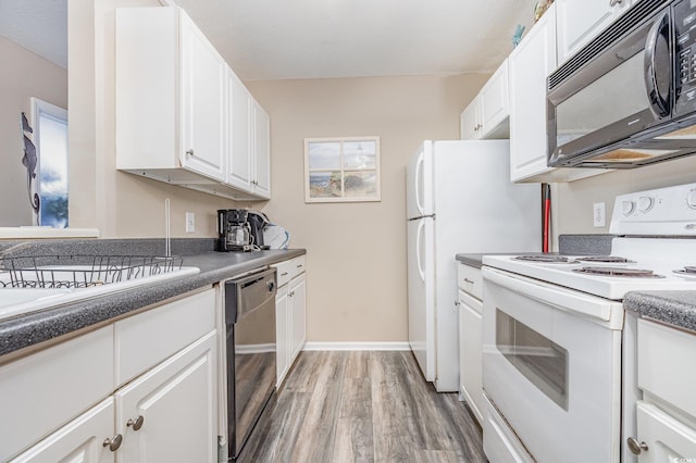 kitchen with electric stove, stainless steel dishwasher, white cabinetry, and light hardwood / wood-style floors