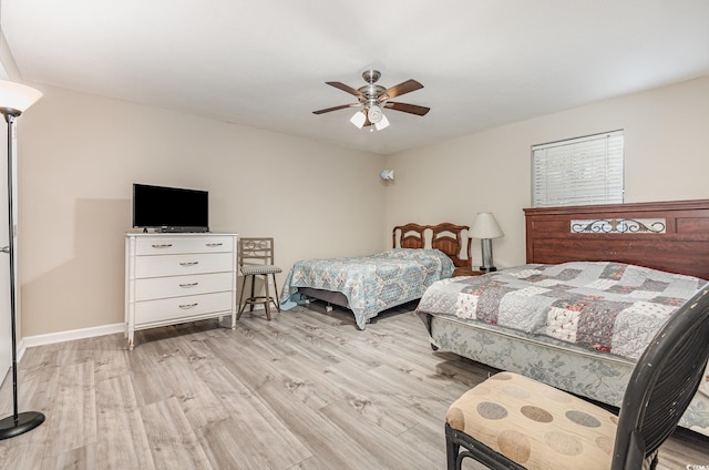 bedroom featuring ceiling fan and light hardwood / wood-style flooring