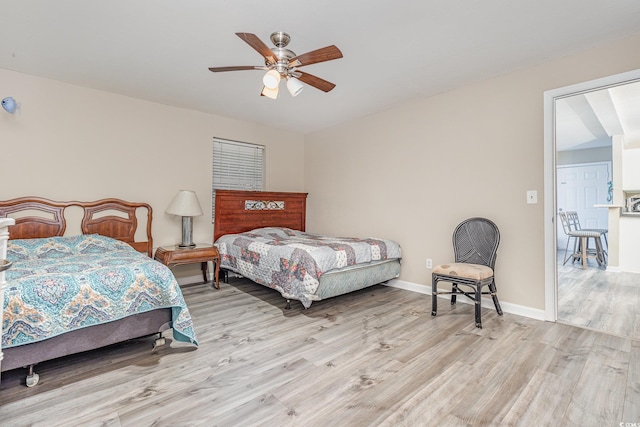 bedroom featuring ceiling fan and light hardwood / wood-style flooring