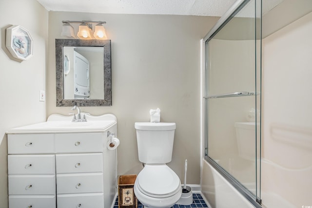 full bathroom with bath / shower combo with glass door, vanity, and toilet