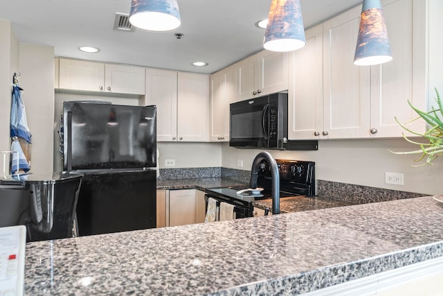 kitchen with visible vents, recessed lighting, white cabinets, and black appliances