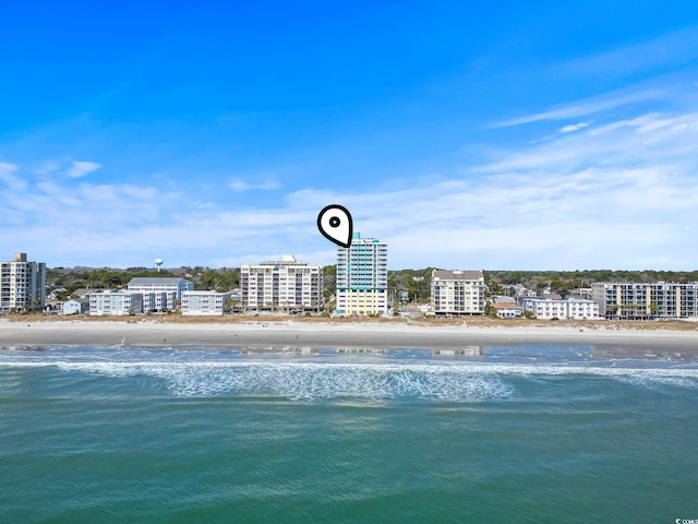 bird's eye view with a view of city, a water view, and a view of the beach