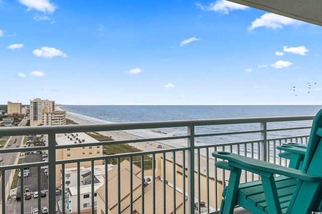 balcony featuring a beach view and a water view