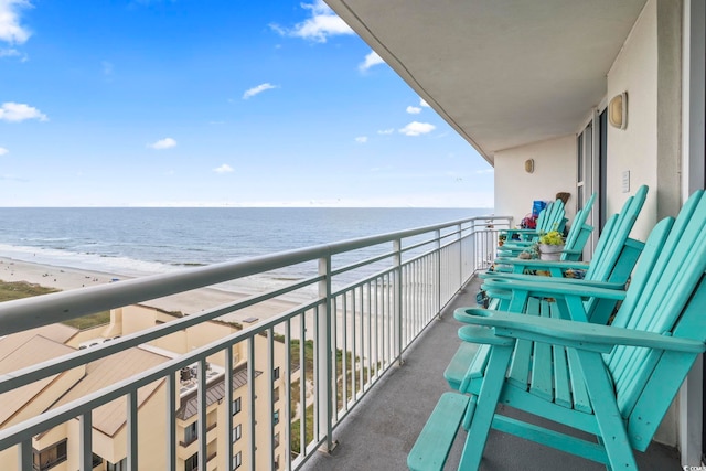 balcony with a view of the beach and a water view