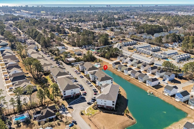 bird's eye view featuring a water view and a residential view