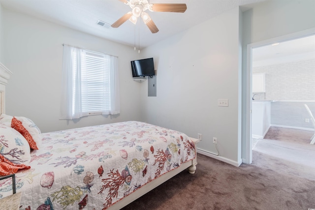 carpeted bedroom with visible vents, ceiling fan, and baseboards