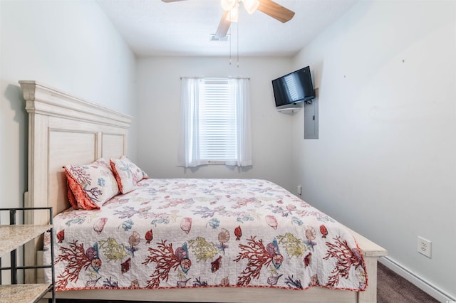 carpeted bedroom featuring baseboards and ceiling fan