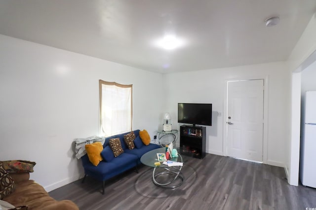 living room with baseboards and dark wood-style flooring