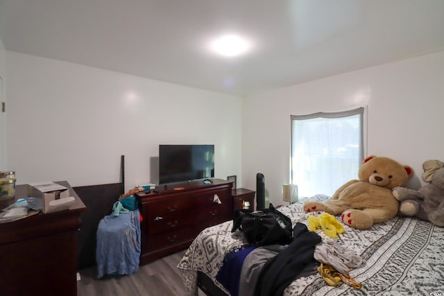 bedroom featuring wood finished floors