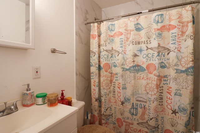 bathroom with a shower with shower curtain, toilet, and vanity