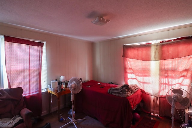 bedroom with wood finished floors