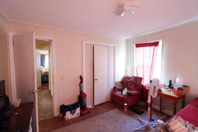 bedroom featuring wood finished floors and a closet