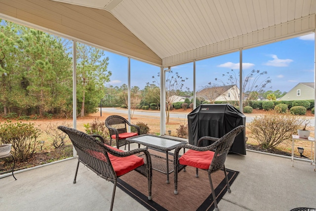 sunroom featuring lofted ceiling