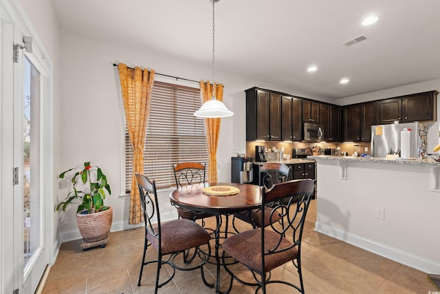 view of tiled dining space