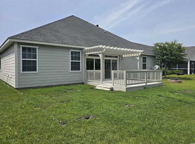1537 Beaumont Way, Myrtle Beach, SC 29577 - back of house featuring a pergola, a shingled roof, a wooden deck, an outdoor fire pit, and a yard