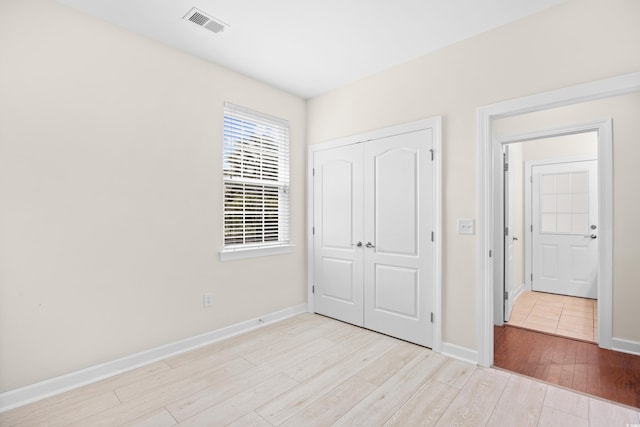 1537 Beaumont Way, Myrtle Beach, SC 29577 - unfurnished bedroom with wood finished floors, a closet, and baseboards