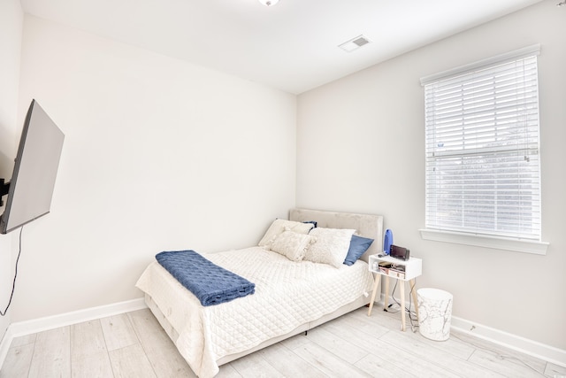 bedroom featuring light wood-type flooring