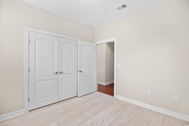 1537 Beaumont Way, Myrtle Beach, SC 29577 - unfurnished bedroom featuring wood finished floors, a closet, and baseboards