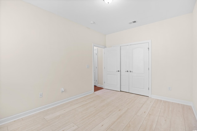 1537 Beaumont Way, Myrtle Beach, SC 29577 - unfurnished bedroom featuring light wood-style flooring, baseboards, and a closet