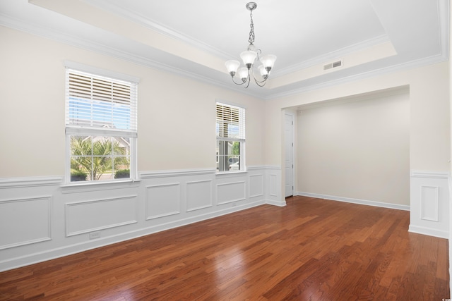 1537 Beaumont Way, Myrtle Beach, SC 29577 - empty room with a chandelier, crown molding, wood finished floors, a wainscoted wall, and a raised ceiling